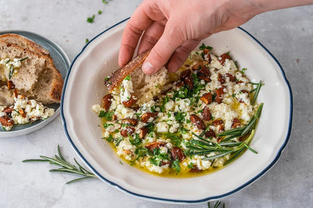 Warm feta dip with rosemary olive oil