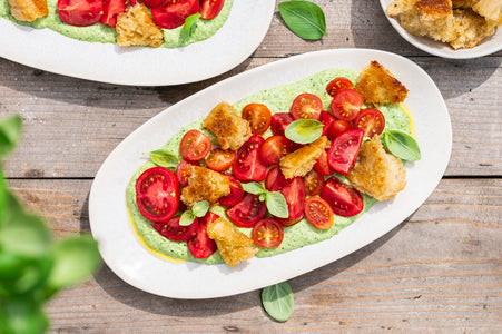 Tomatoes on herb cream with toasted bread